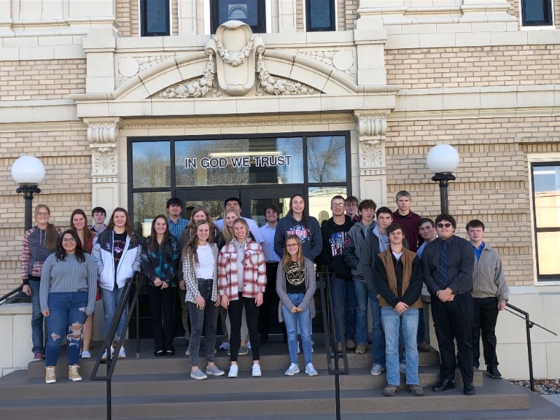 students standing in front of building